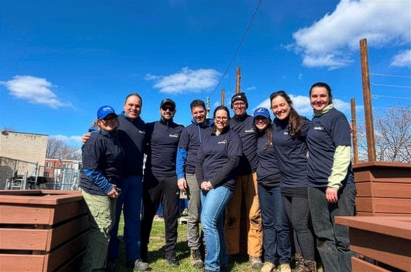 A group of Suncor employees volunteer at a community garden. 