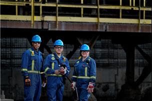 Three workers at Base Plant.