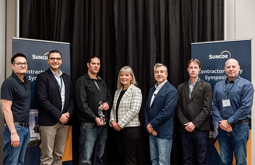 Leaders from Suncor Energy and Sterling Burrows / Ledcor Industrial pose for a photo at the September 2026 Contractor Safety Symposium in Fort McMurray, Alberta.